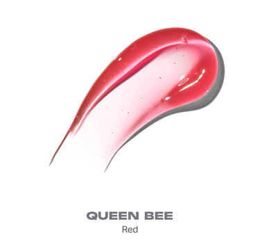 {Queen Bee} Hot Honeys Plumping Lip Oil swatch in Queen Bee Red, glossy red lip oil smear with shiny finish on white background.