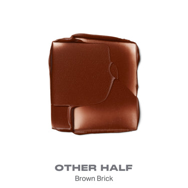 {Other Half} Soulmatte Velvet Lip Mousse swatch in brown brick showing matte velvet texture, labeled OTHER HALF / Brown Brick.