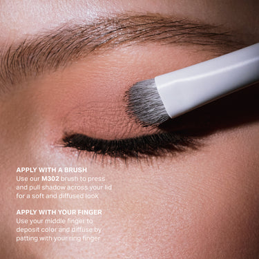 {Setlist} Solo Artist Priming Cream Eyeshadow applied to eyelid with M302 brush; text reads "APPLY WITH A BRUSH Use our M302 brush to press and pull shadow across your lid for a soft and diffused look APPLY WITH YOUR FINGER Use your middle finger to deposit color and diffuse by patting with your ring finger"