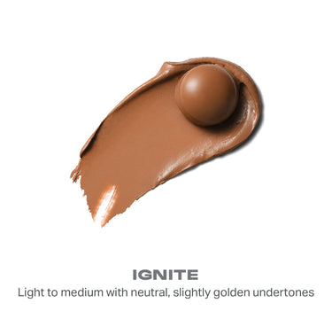 {Ignite} Sudden Heat Creamy Bronzer Stick smear swatch with bullet tip. IGNITE: Light to medium with neutral, slightly golden undertones.