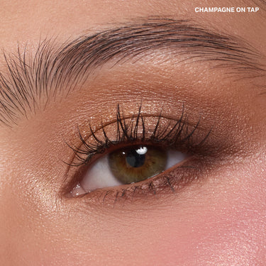 {Champagne On Tap} Dazzling Metallics Eyeshadow Trio close-up eye look with warm champagne metallic shadow, text reads CHAMPAGNE ON TAP.
