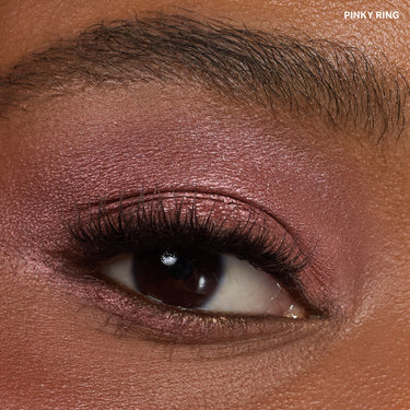 {Pinky Ring} Close-up eye macro showing the Dazzling Metallics Eyeshadow Trio in shade PINKY RING, a rose metallic look on deep skin.