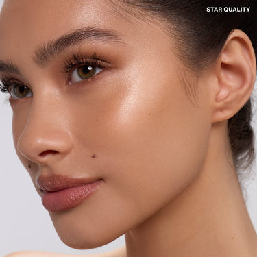{Star Quality} Dreamlight Gelee Highlighter Stick in Star Quality shown on model