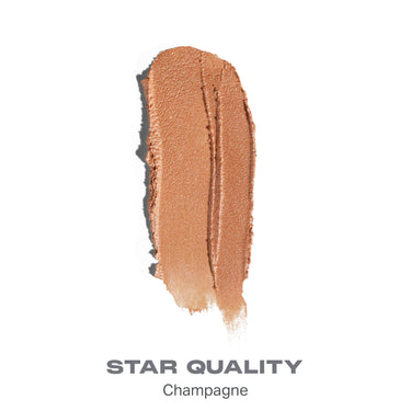 {Star Quality} Dreamlight Gelee Highlighter Stick shade swatch in champagne-gold with text "STAR QUALITY Champagne."